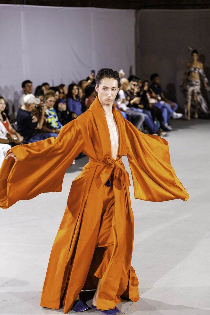 Burnt-orange cape gown from LA Fashion Week / The Bureau